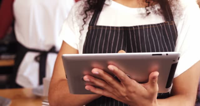 Server ringing in food on tablet